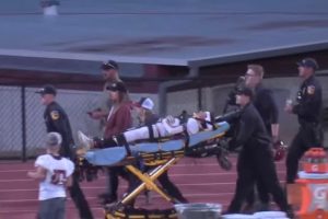 Concerned players looking on as Derek is being wheeled out of Thorsted Stadium in Tuolumne