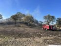 Escaped debris burn fire behind Elizabeth Court in Burson