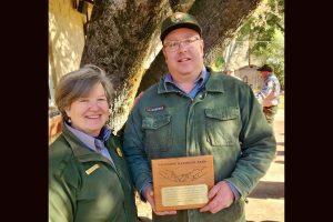 (L to R) Yosemite National Park Superintendent Cicely Muldoon presents park employee Jon Babcock with the 2023 Barry Hance Award