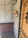 Pencils indicating where the bullets that were fired went through the bar door