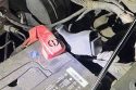Handgun found under the vehicle's hood -- ACSO photo