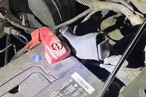 Handgun found under the vehicle's hood -- ACSO photo
