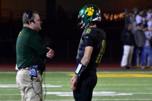Kirk Clifton speaking with a player last season while still the offensive coordinator