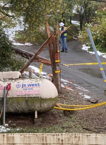 Broken power pole and downed lines