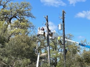 PG&E crew working on power pole and lines in Sonora