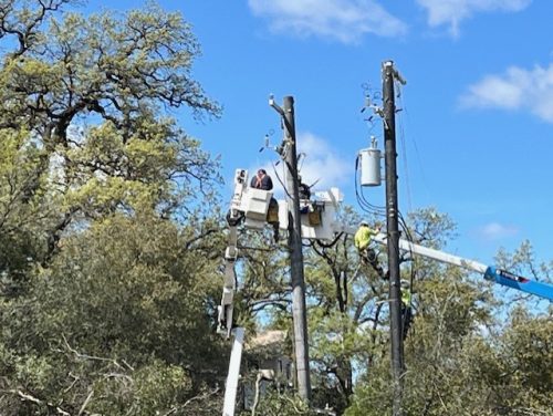 PG&E crew working on power pole and lines in Sonora