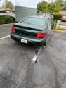 Car engine fire with rock behind the wheel of the sedan at the Tuolumne City Senior Apartments
