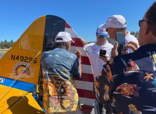 Veteran Al Andrus signing the Dream Flights rudder