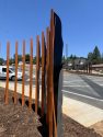 Mural flicker feather gateway features at the 49/140 four-way stop on the north side of Mariposa