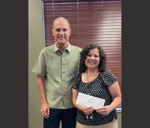 SAF CEO Darrell Slocum and Columbia Elementary Music Teacher Diane Ditler