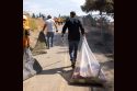 Governor Gavin Newsom picking up trash to celebrate three years of the Clean California initiative