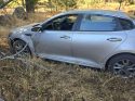 Kia Optima that crash through a fence -- Oakhurst CHP photo