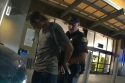 Ruhga being arrested by officer -- SPD photo