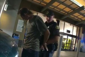 Ruhga being arrested by officer -- SPD photo