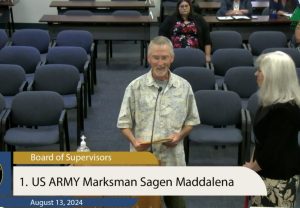 Randy Maddalena receives a proclamation on behalf of daughter Sagen.