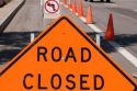 Road closed sign with cones