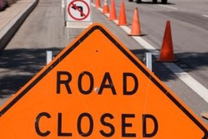Road closed sign with cones