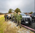 Tuolumne County Sheriffs Deputies line Striker Court to cheer on the Bears football team buses heading to the championship game