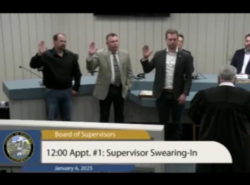 Mike Holland, Steve Griefer and Jaron Brandon take the oath of office
