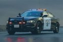 CHP vehicle in rain with lights on
