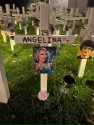 Cross with Machado's daughter, Angelina Spills , on it -- FACTS photo