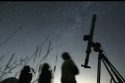 People look up to the sky from an observatory near the village of Avren Bulgaria Aug. 12 2009. (AP Photo-Petar Petrov, File)