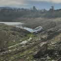 San Andreas CHP Unit photo of an SUV stuck near New Hogan Lake in the Valley Springs area of Calaveras County reminding drivers to obey all signage regarding private property