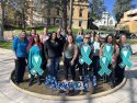 CNVC volunteers putting up teal ribbons in downtown Sonora -- photo by Pamela Orebaugh
