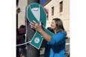 CNVC volunteers putting up teal ribbons in downtown Sonora -- photo by Pamela Orebaugh
