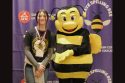 Selah England poses with the Spelling Bee mascot -- TCSOS photo