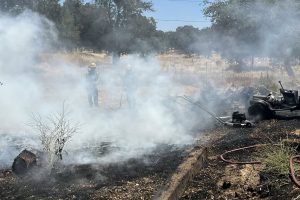 Fire in Wallace showing riding lawn mower that ignited the blaze—CCF photo