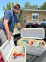 Caregiver Al Araujo with ice chest drinks—PAWS photo