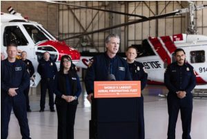 Governor Gavin Newsom flanked by CAL Fire officials