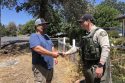Sheriff's Deputy returning the wallet to its rightful owner—TCSO photo