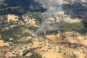 Structure fire into vegetation fire in the San Andreas area near the airport—CAL Fire TCU photo