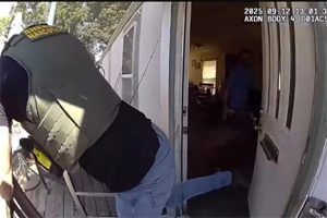 TCSO TNT member kicking the door in at the Jamestown residence—TCSO photo
