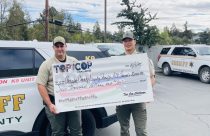 ACSO Sergeant Kyle Wilson and Deputy Rick Tran holding check—ACSO photo