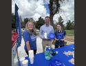 (Cntr) Brett Christopher, Summerville High School principal at a Blue Zones Project event with Gemi Battle BZP organization lead and Marie Schermeister, BZP events and office specialist