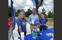 (Cntr) Brett Christopher, Summerville High School principal at a Blue Zones Project event with Gemi Battle BZP organization lead and Marie Schermeister, BZP events and office specialist
