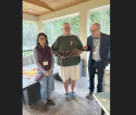 John Sproull Of Arnold holds the winner of the Calaveras Pinecone contest - Photo courtesy of Marlaine Cover