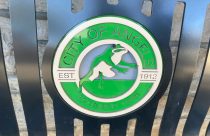City of Angels Camp logo on bench in downtown