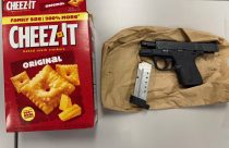 Cheez-It box and handgun seized in truck search—ACSO photo