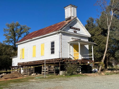 Douglas Flat Schoolhouse being placed on new foundation