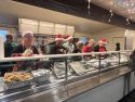 Santa's helper keep the meals coming—Photo Tracey Petersen