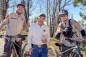 Iwata with the two unidentified TCSAR e-bike rescuers who found him—TCSO photo