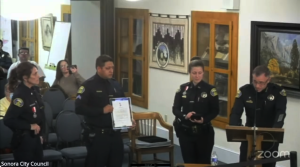Starting at the left, Lt. Jennifer Hannula and Officer Rodolfo Figueroa receive recognition