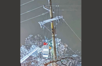 A PG&E worker helps to restore power Wednesday evening in Willow Springs - Courtesy photo by Sylvia Fraga