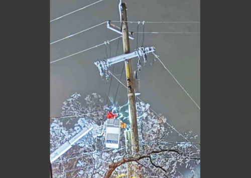 A PG&E worker helps to restore power Wednesday evening in Willow Springs - Courtesy photo by Sylvia Fraga