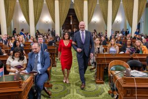 Cherilyn Bairos escorted by Heath Flora
