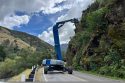 Crane working on slope repairs after rockslide on Hwy 140—Caltrans photo